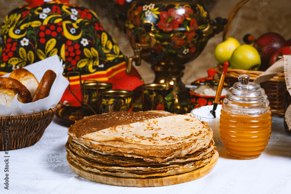 Pancakes with honey on the table in the Ukrainian  or Russian style