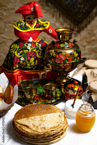 Pancakes with honey on the table in the Ukrainian  or Russian style