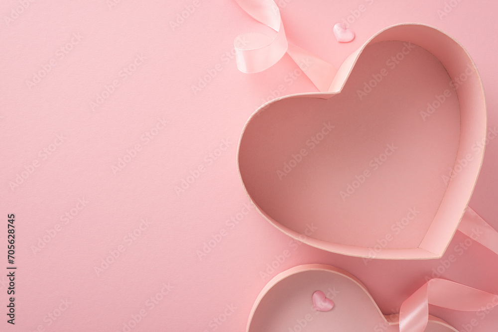Valentine's elegance: Discover allure of love through top-view scene featuring empty heart-shaped giftbox on pastel pink canvas. Surrounding hearts create enchanting backdrop, ready for your touch