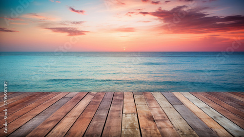 Wooden floor with blur sea at sunset