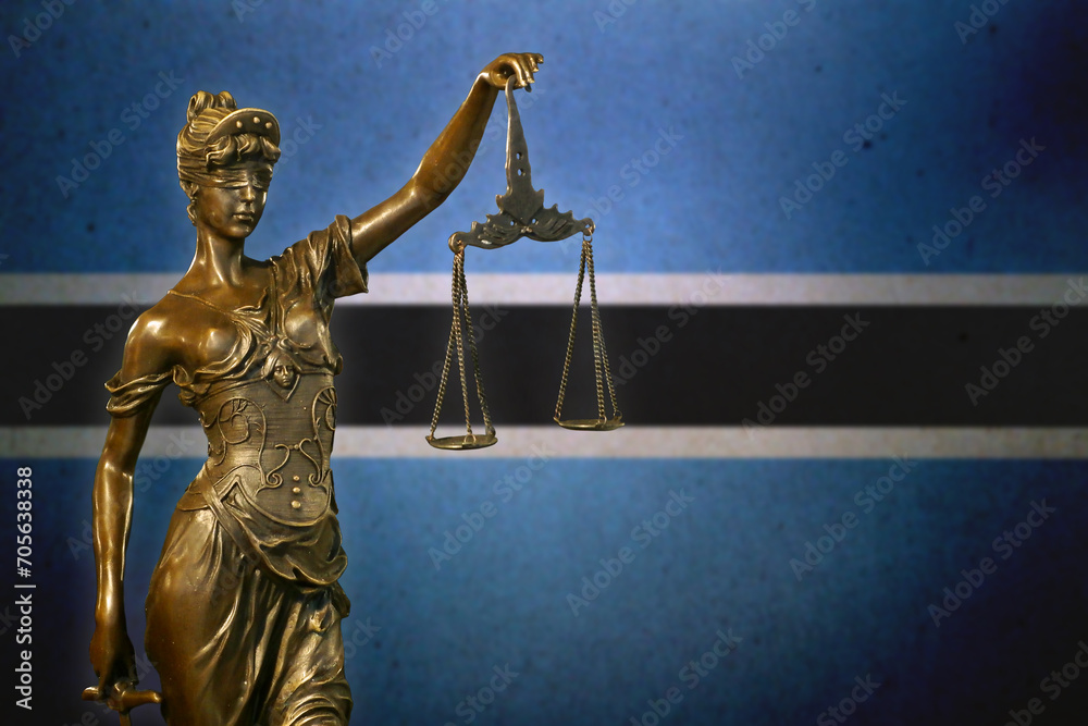 Lady Justice against a flag of Botswana Lady Justice against a flag of Botswana