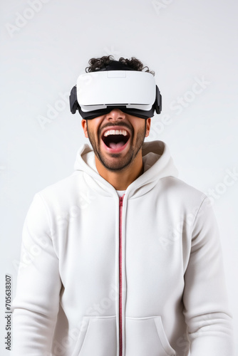 Man wearing white hoodie and white virtual reality headset.