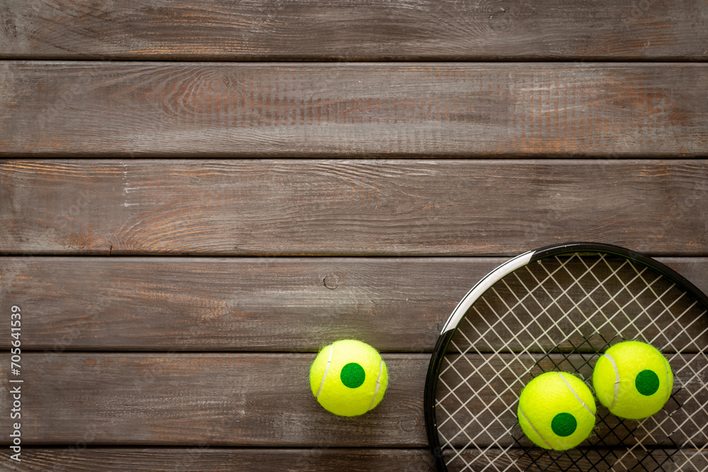 Close up of tennis racquet and balls, top view. Sport games background