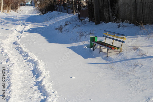 A bench in the snow