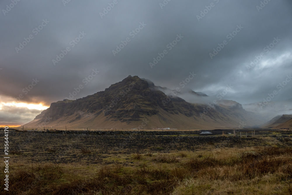 Autumn foggy country and a mountain, South Iceland