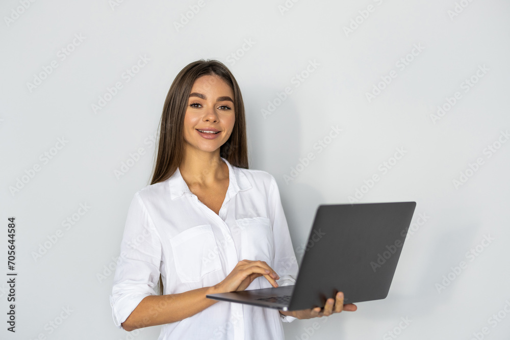Young pretty woman with laptop on white background Young pretty woman with laptop on white background