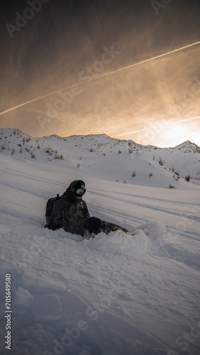 snowboarder sitting in the snow