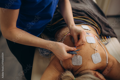 Foto Back Pain Electrode Stimulation And Training. Electrotherapy