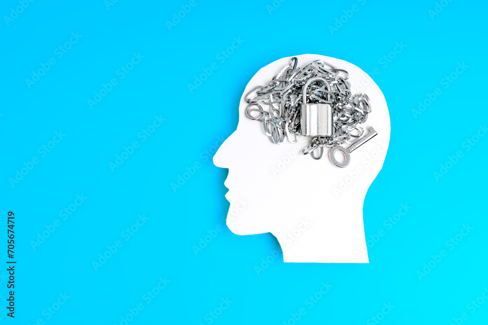 White Paper Silhouette of Male Head with Chain, Lock and Key White Paper Silhouette of Male Head with Chain, Lock and Key