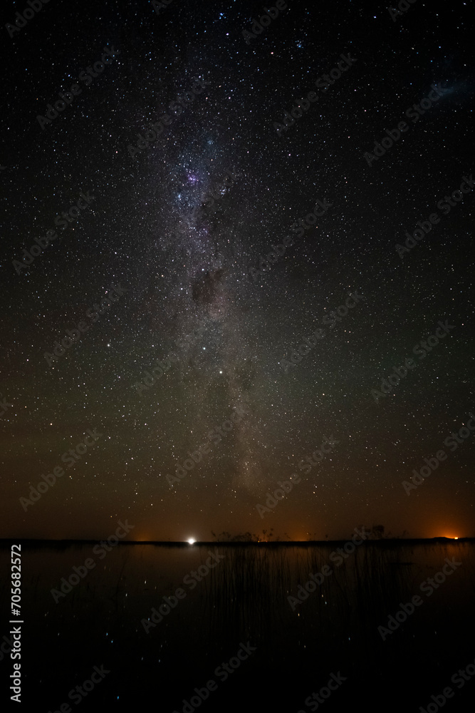 Starry sky reflected in the water, La Pampa Province, Patagonia, Argentina.
