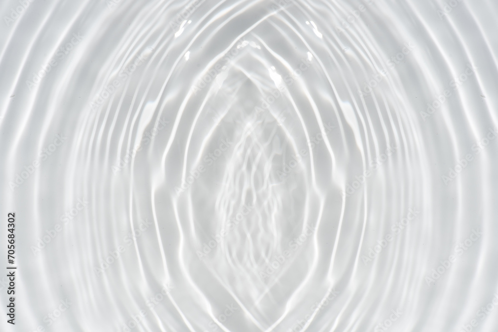 White water with ripples on the surface. Defocus blurred transparent white colored clear calm water surface texture with splashes and bubbles. Water waves with shining pattern texture background. White water with ripples on the surface. Defocus blurred transparent white colored clear calm water surface texture with splashes and bubbles. Water waves with shining pattern texture background.