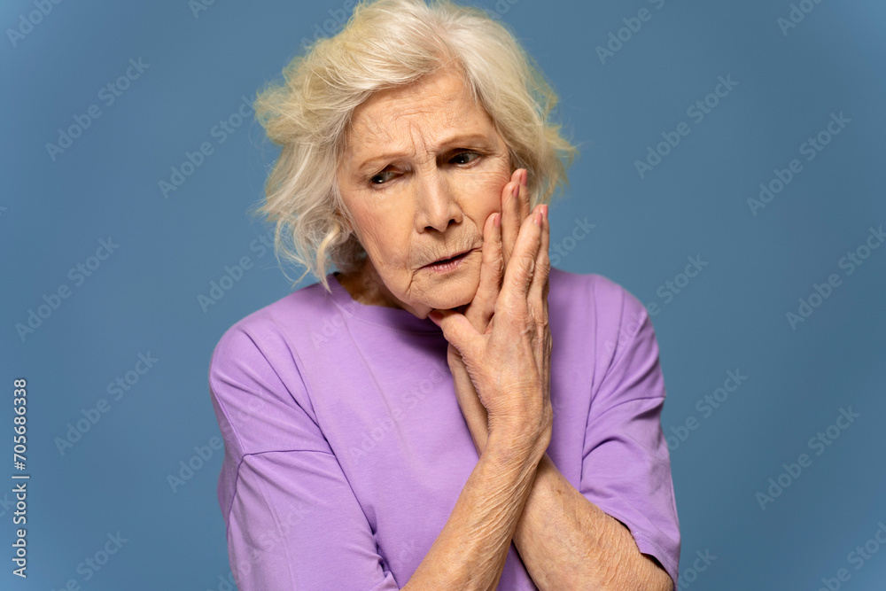Tense elderly caucasian woman with toothache Tense elderly caucasian woman with toothache