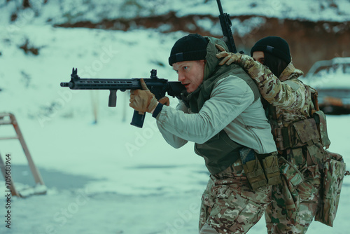 Military training. People training in tactical shooting. photo