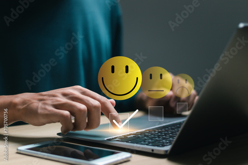User rate satisfaction by smiling face, on online application. satisfaction feedback review, good quality most. Customer satisfaction service concept. photo