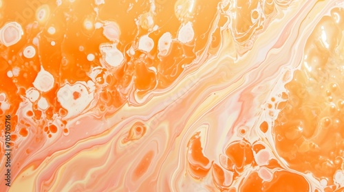 Abstract background in peach, pink and yellow colors with liquid acryllic splashes texture