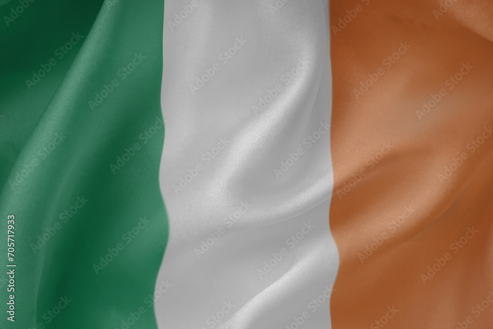 Fototapeta premium Ireland waving flag close up fabric texture background