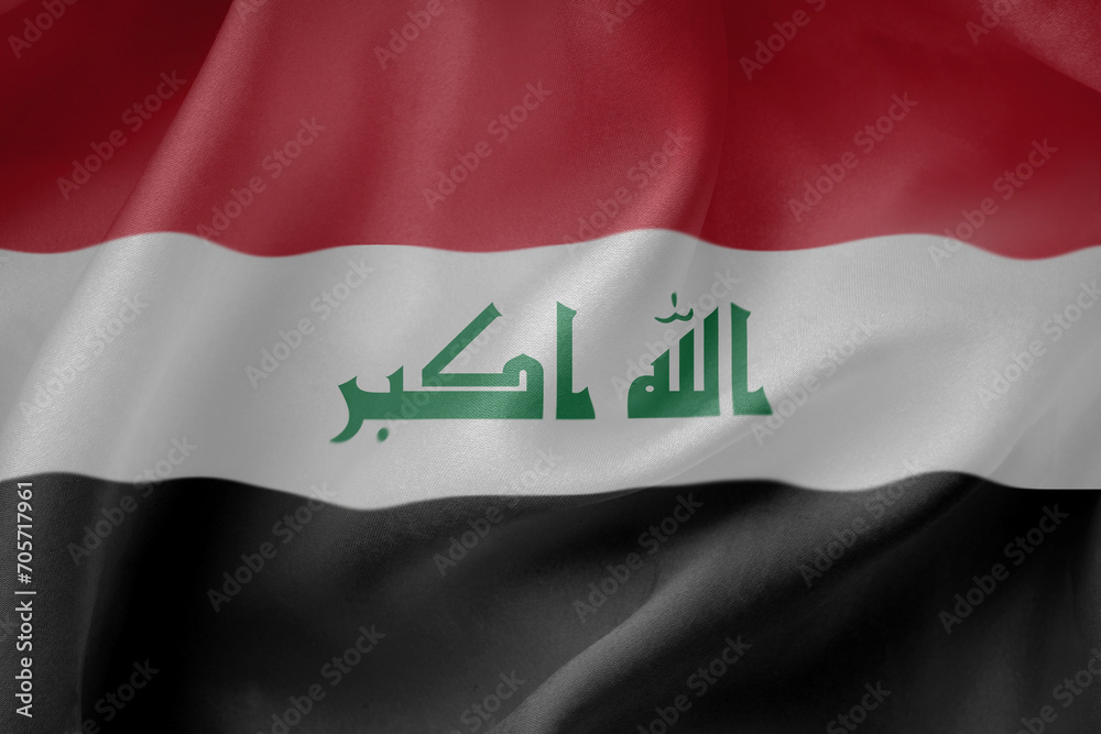 Naklejka premium Iraq waving flag close up fabric texture background