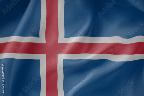 Iceland waving flag close up fabric texture background