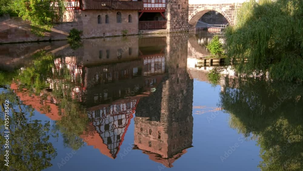 Reflection of Wasserturm in the River Pegnitz in Nuremberg, Germany. Taken on a still summer after noon