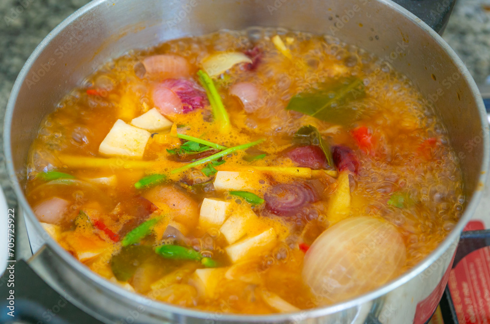 Tom Yum soup is boiling in the pot. Thailand favorite food. sour and spicy soup local food of Thailand