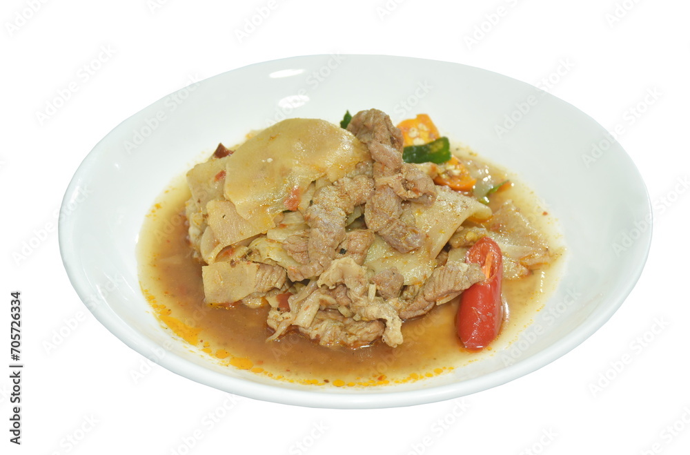 spicy fried slice pickled bamboo shoot with beef meat in curry sauce on plate