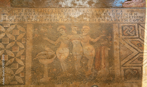 The three daughters of Zeus, the chief god of the ancient period, Aglaia, Thalia, and Euphrosine are depicted in the mosaic created with black, white, and yellow stones.