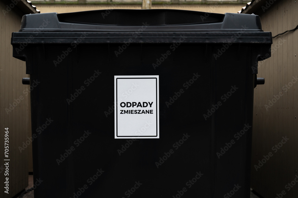 General waste bin in Poland. Trash dumpster on the city street. Big garbage container, public