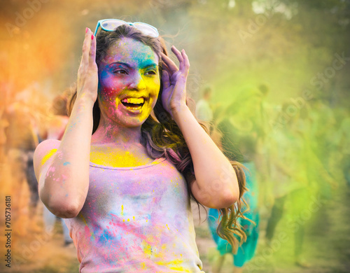 Happy young girl on holi color festival