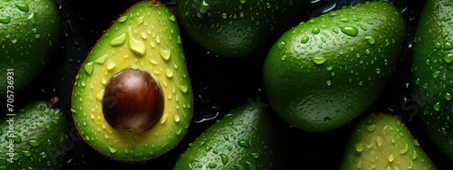 Close-Up of Fresh Avocados With Water Droplets on a Dark Surface