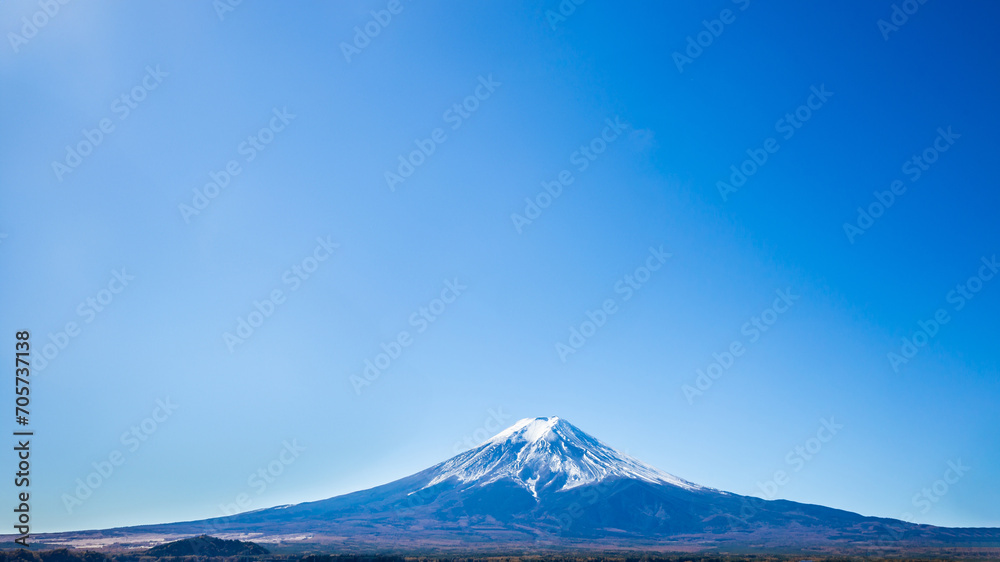 Panorama of Mount Fuji with blue sky in the foreground in autumn in Kawaguchiko, Yamanashi, Japan. Copy space background