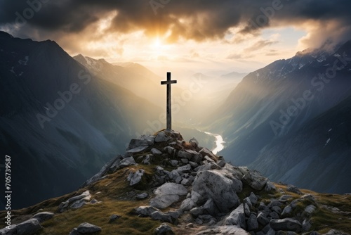  a cross on top of a mountain with a river running through the valley in the distance under a cloudy sky with sun rays coming through the clouds over the mountains. #705739587