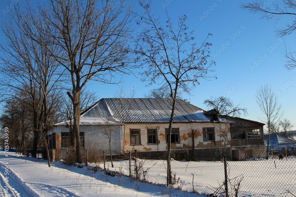 A house with snow on the ground A house with snow on the ground