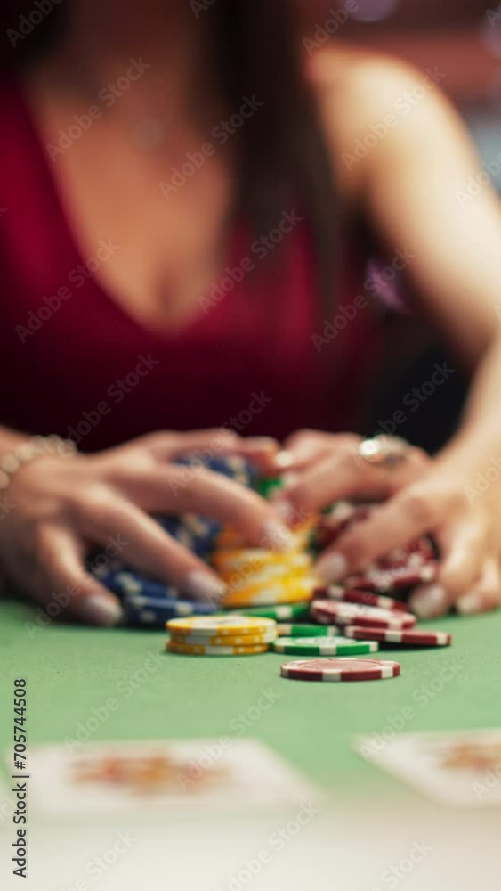 Vertical Screen: Anonymous Glamorous Woman in an Evening Dress Collecting Her Prize of Poker Chips in a Luxury Casino. Lucky Female Winner Hitting the Jackpot, Happy and Rich. Slow Motion Shot.