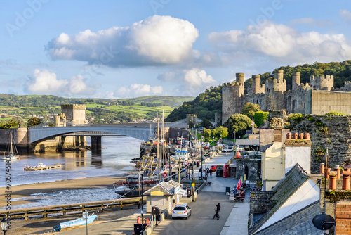Conwy, North Wales - The waterfront, castle and two bridges on a fine autumn afternoon. photo