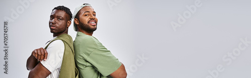 banner of african american friends standing with folded arms on grey background, Juneteenth