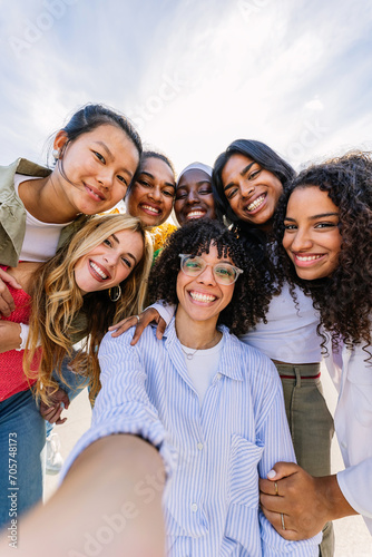 Photography Diverse group of happy young best female friends having fun together outdoors