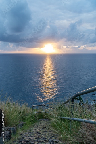 Sunset over the ocean from a hiking trail at madeira island