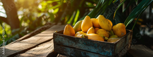 delicious carambola fruit in a wooden box on the background of nature. photo