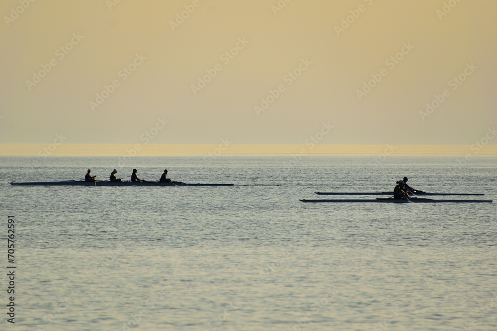 Naklejka premium rowing (skiff) at sunset - Paralia Richa Nera (beach), Myrina, Lemnos island, Greece, Aegean sea