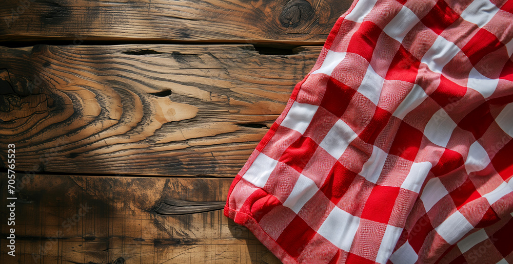 Top view of red checkered tablecloth on blank empty wooden table background banner, food concept Top view of red checkered tablecloth on blank empty wooden table background banner, food concept