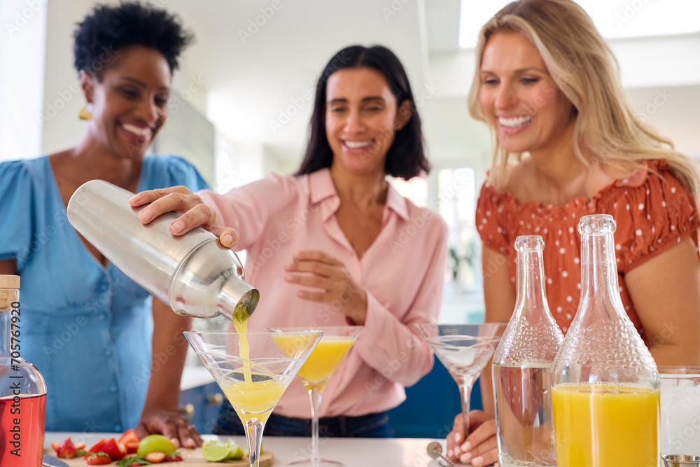 Three Mature Female Friends At Home Having Fun Mixing Cocktails Together Three Mature Female Friends At Home Having Fun Mixing Cocktails Together