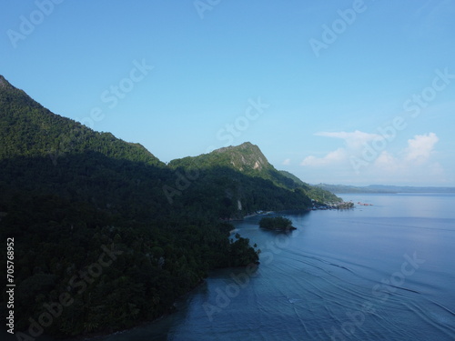 Tranquil Scene of a Beautiful Bay with Blue Water and a Scenic Landscape in sawai saleman, maluku, indonesia