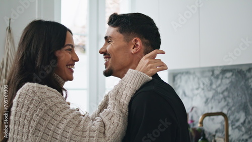 Romantic couple laughing at domestic kitchen close up. Two people enjoying time