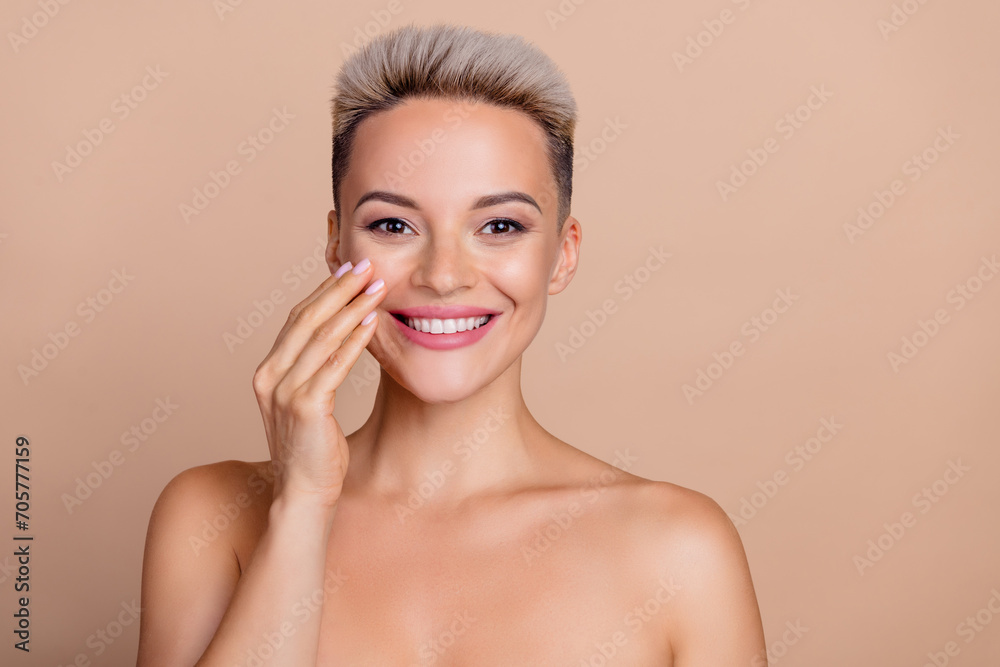 Photo of happy attractive girl touch cheeks applying beauty product for silky skin isolated over pastel color background Photo of happy attractive girl touch cheeks applying beauty product for silky skin isolated over pastel color background