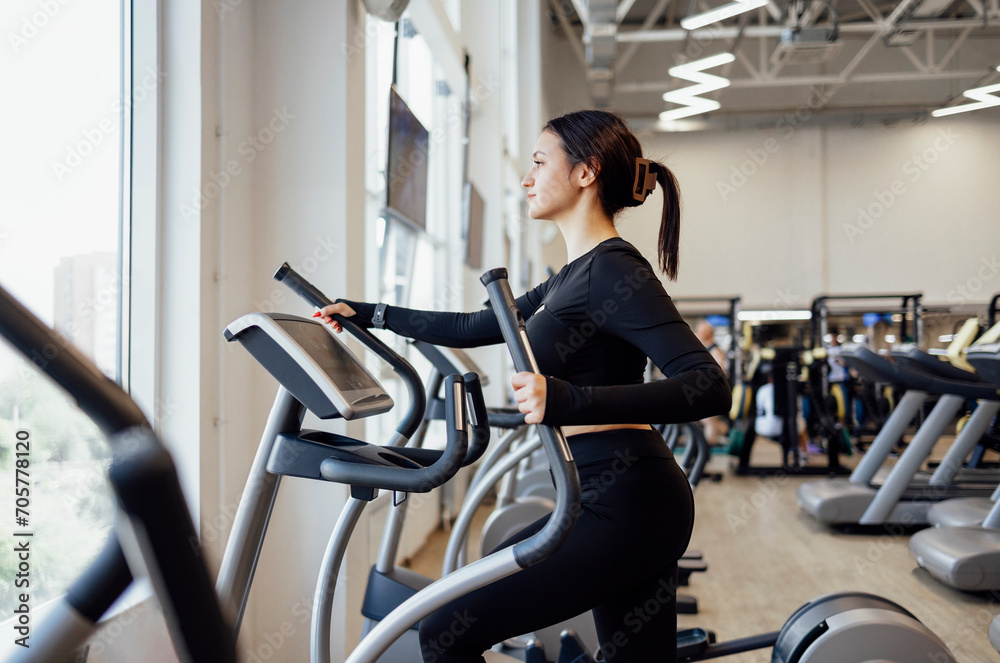 Doing cardio on the treadmill. Running on a treadmill.