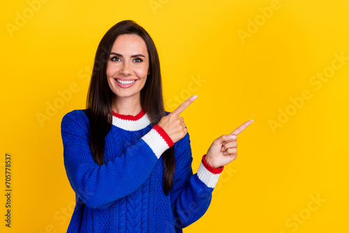 Photo of satisfied mature age woman brunette hair hispanic model in blue jumper direct fingers mockup isolated on yellow color background
