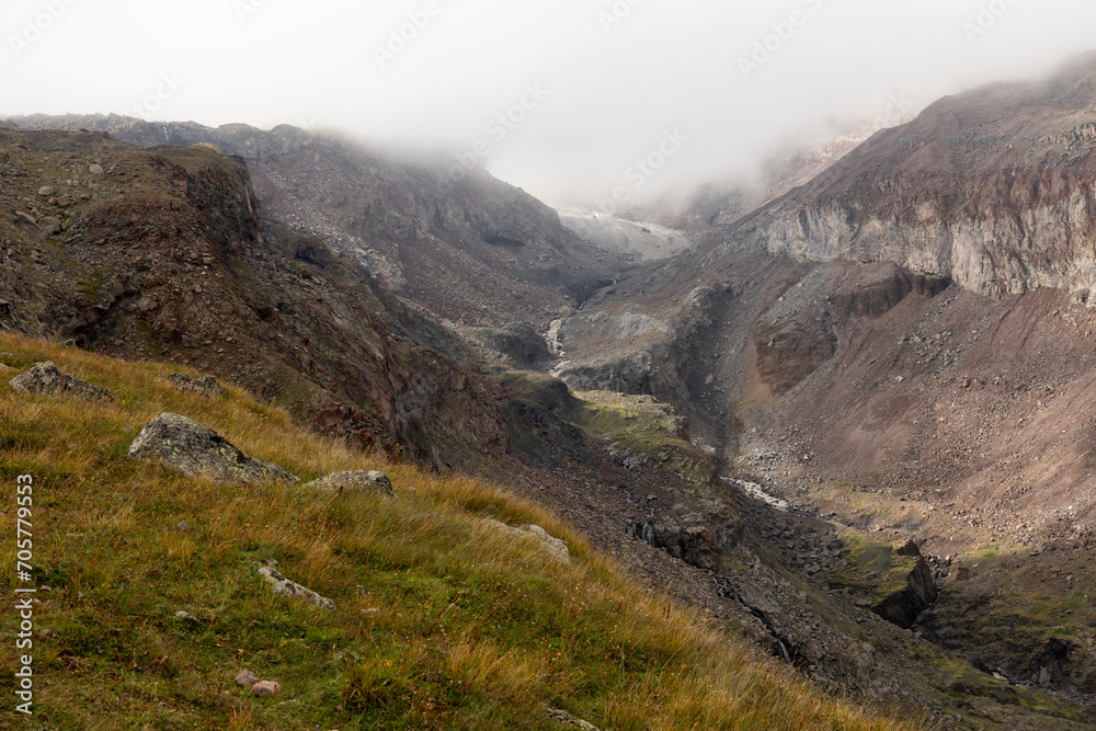 Fototapeta premium Panoramic landscape of glacial mountain valley during summer in Caucasus mountains