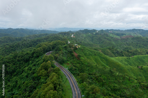 The road is similar to the number 3, This road is built on a mountain, past the forest in Nan Province of Thailand.