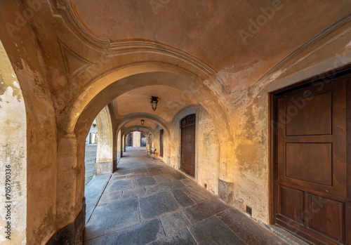 Carignano, Turin, Italy - ancient 18th century arcades of the former town hall in Piazza San Giovanni, typical Savoy architecture