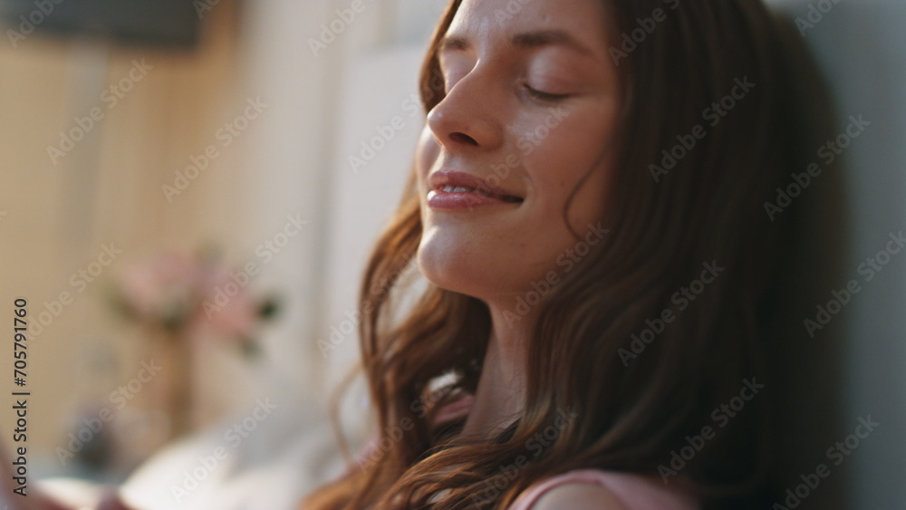 Closeup pretty girl typing mobile phone at cozy home. Hands holding smartphone